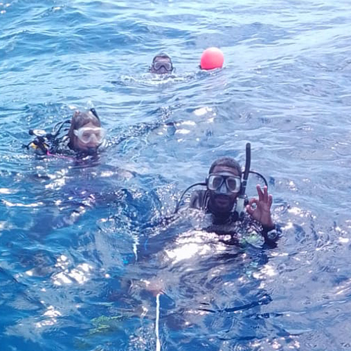 couple snorkeling in ocean